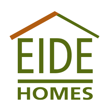 Logo with the text "EIDE HOMES" in green, stylized to look like a house with a brown and green roof outline above the words.